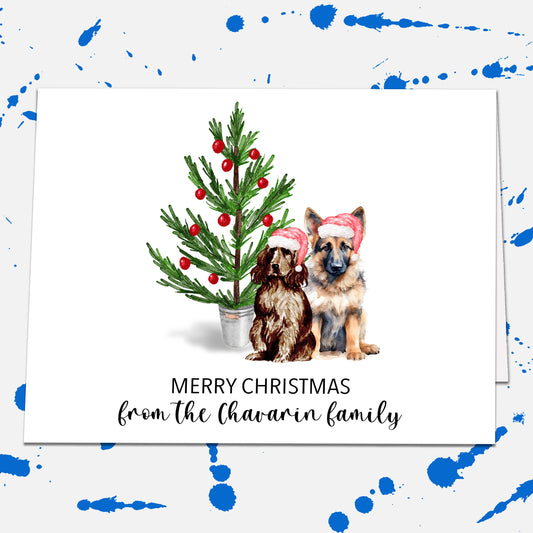 a christmas card with two dogs next to a christmas tree
