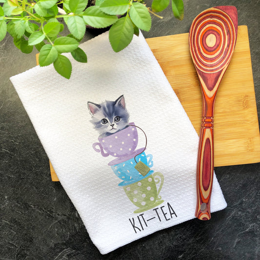 a tea towel with a picture of a kitten on it