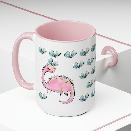 a pink and white mug with a pink dinosaur on it