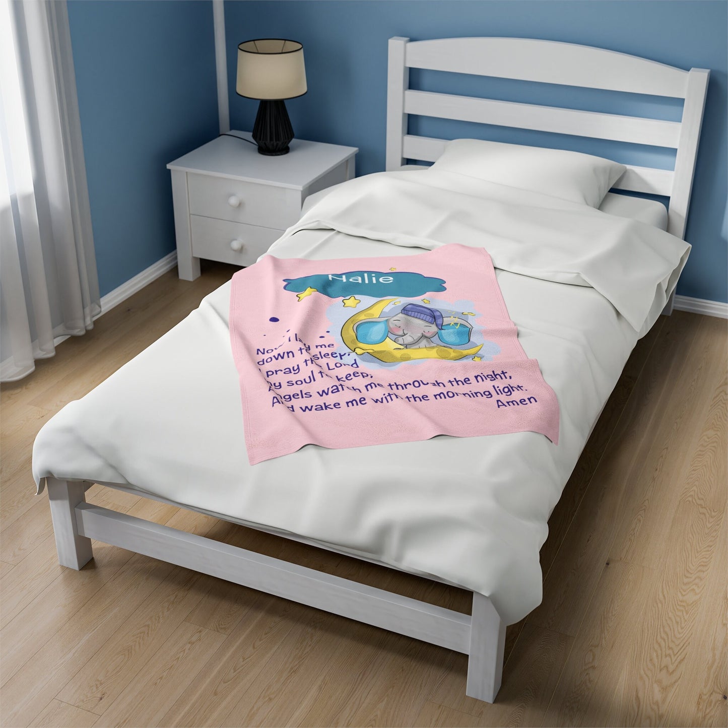 a bed with a pink blanket on top of it