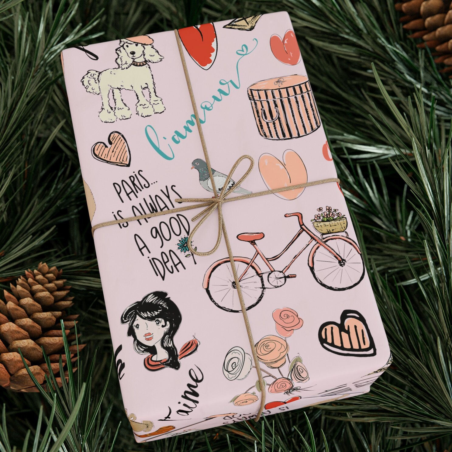 a present wrapped in a pink wrapping paper on a pine tree