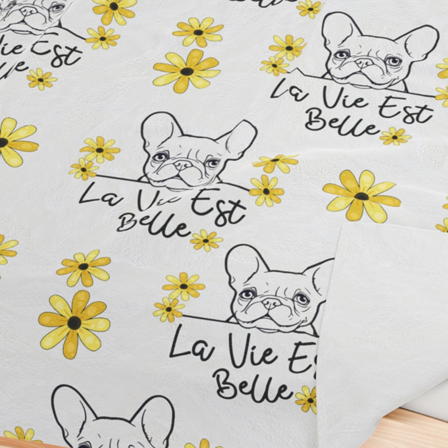 a pair of french bulldogs with yellow flowers on them
