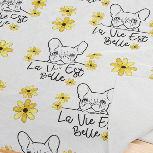 a pair of french bulldogs with yellow flowers on them