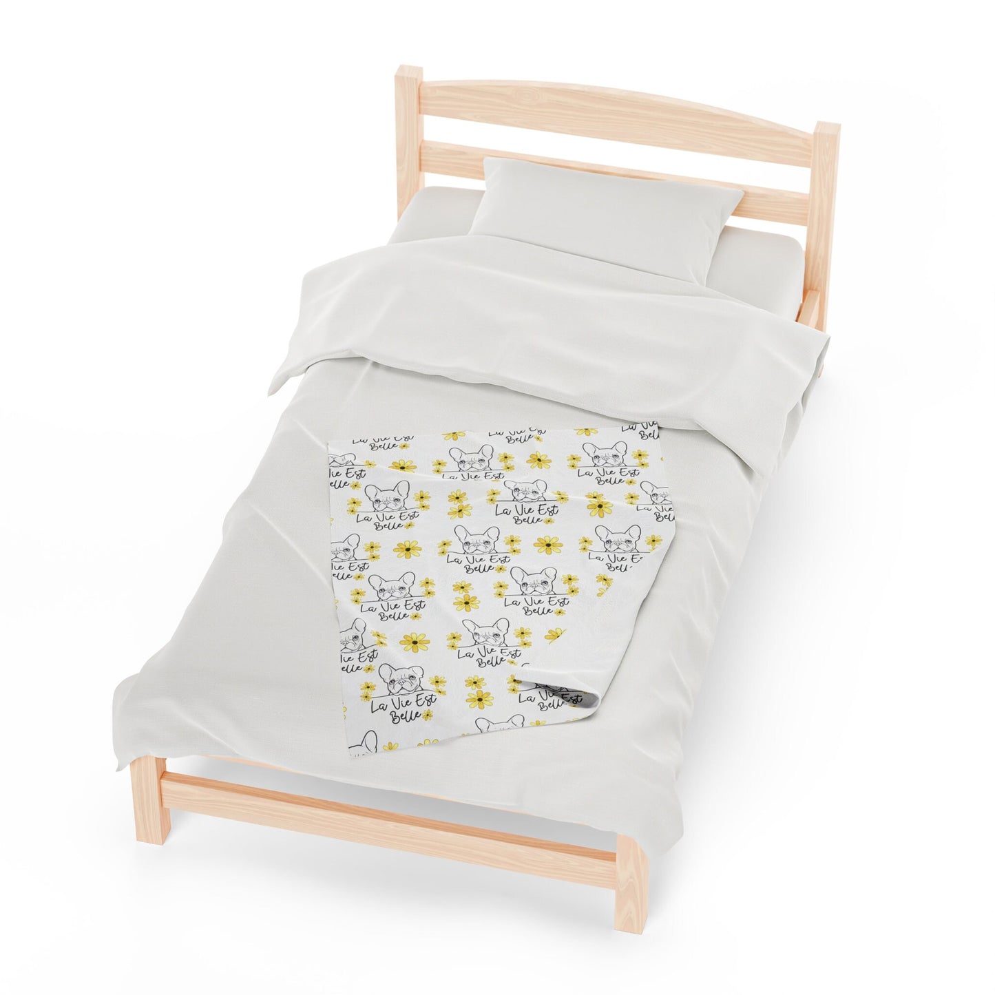 a bed with a white comforter and a wooden frame