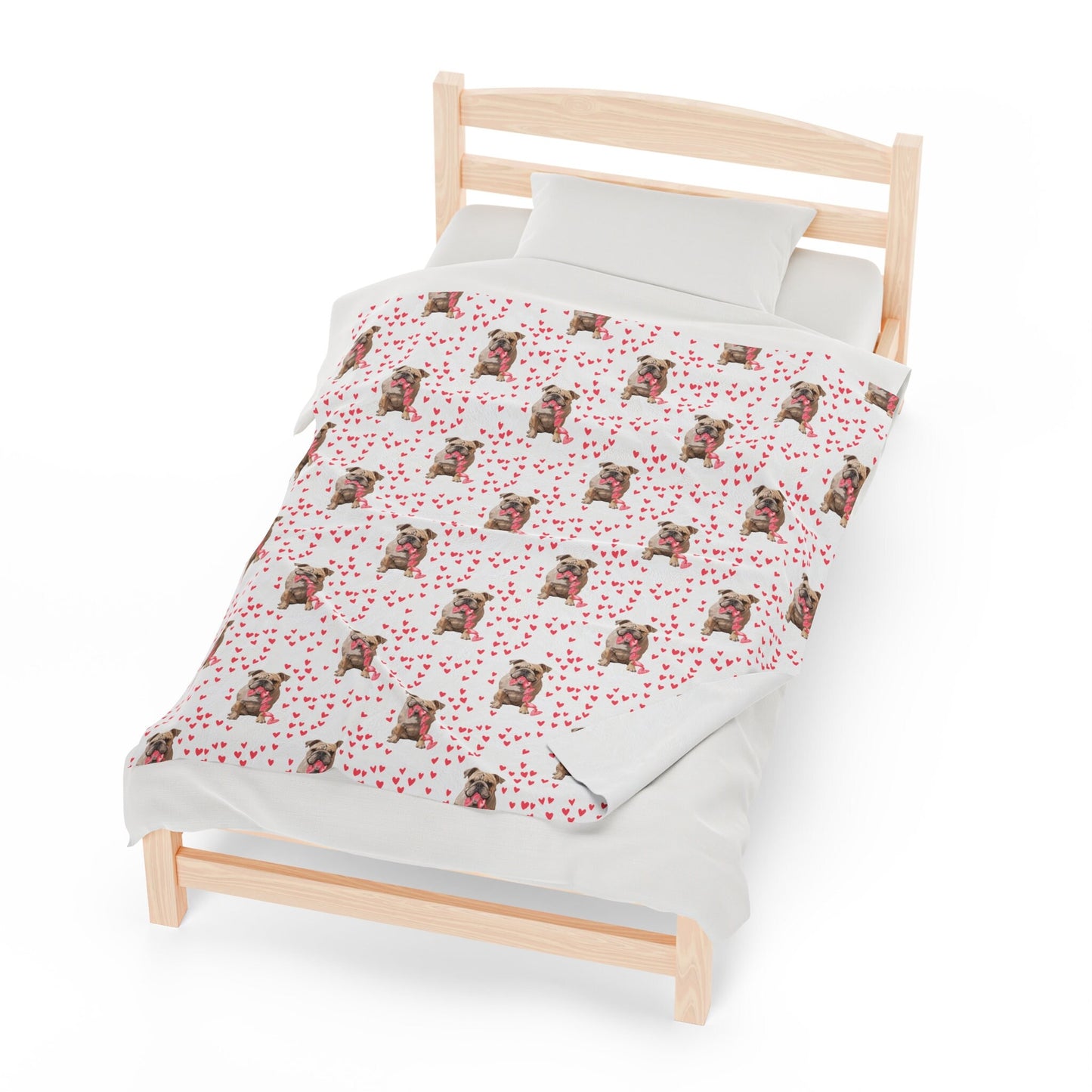 a bed with a white sheet and a red and white pattern