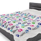 a bed with a dog paw print on it