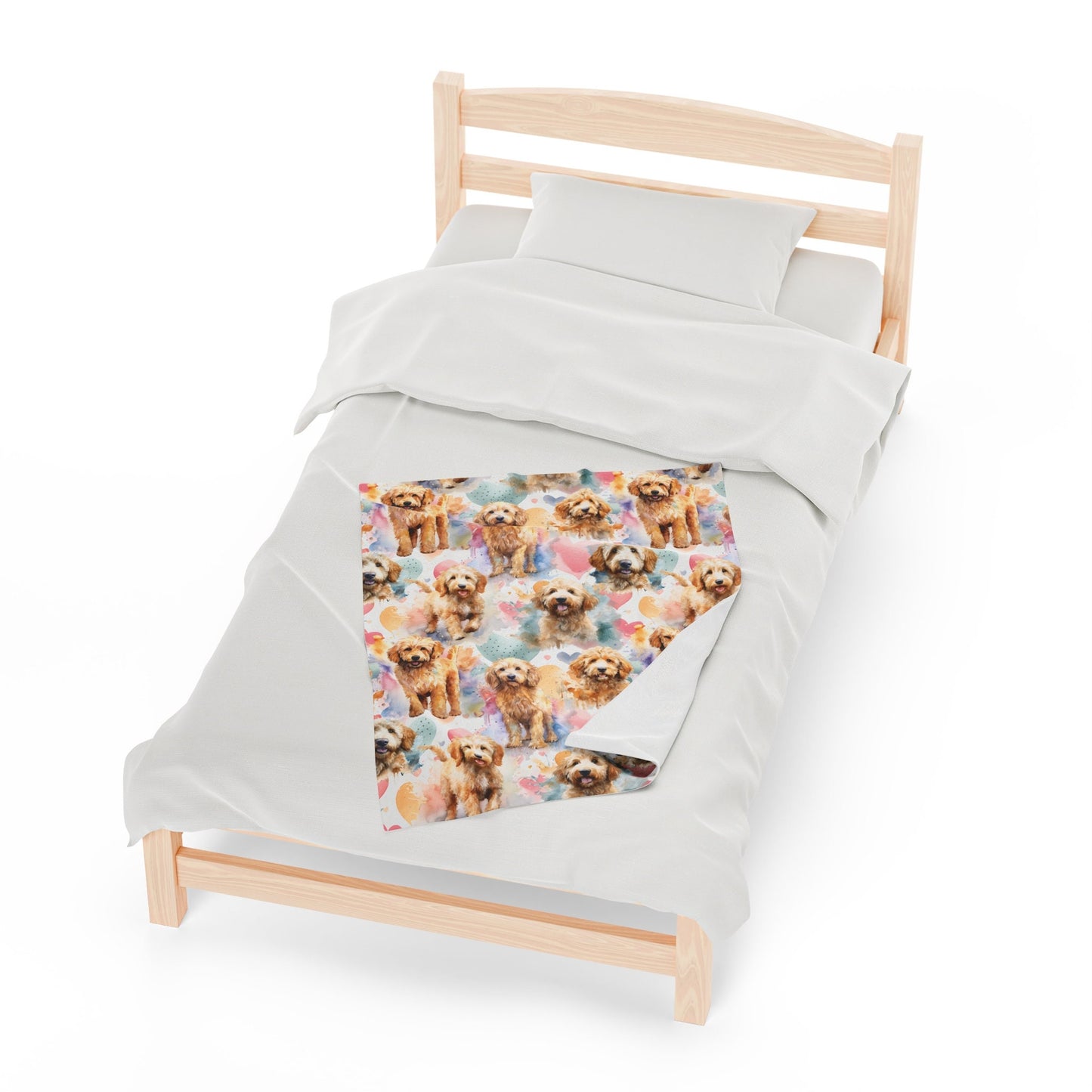 a bed with a white comforter with dogs on it