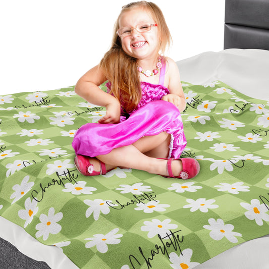 a little girl sitting on top of a bed