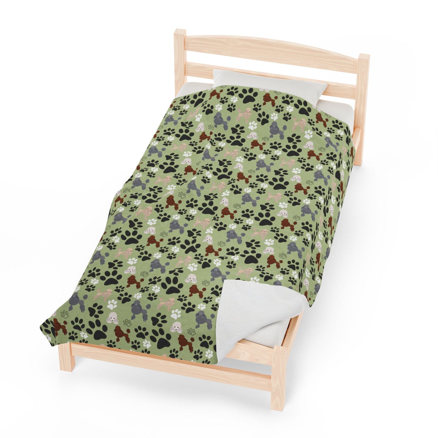 a bed with a dog paw print on it