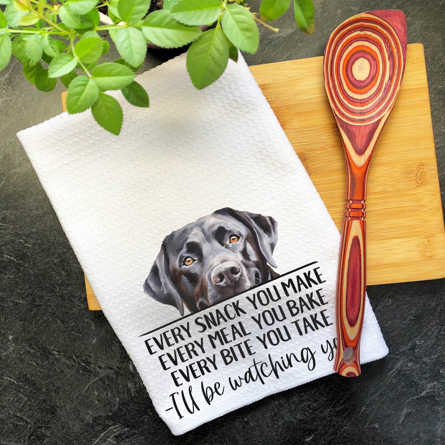 a kitchen towel with a picture of a dog on it