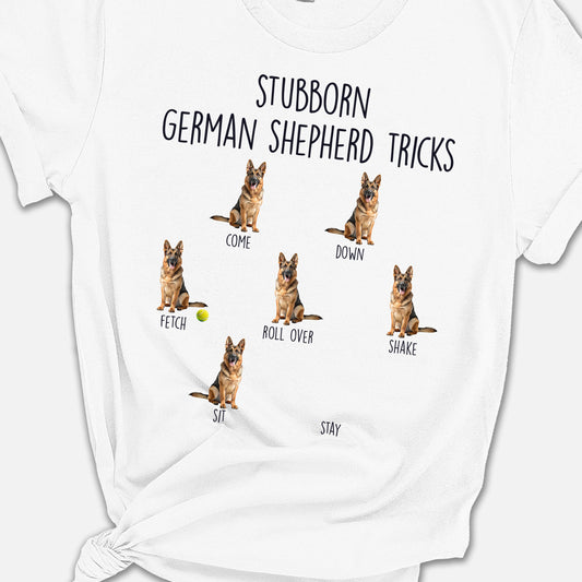 a white shirt with german shepherd tricks on it