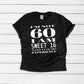Black unisex fit t-shirt printed with a white design that reads I’m not 60 I am sweet 16 with 44 years experience.