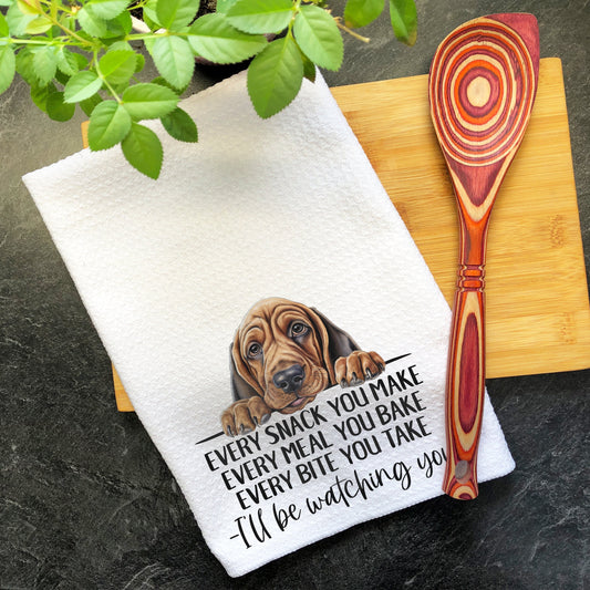 a kitchen towel with a picture of a dog on it