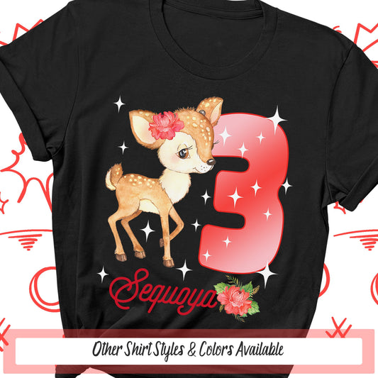a black shirt with the number five and a deer with a flower in its hair