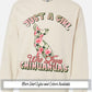 a white sweatshirt with pink flowers on it