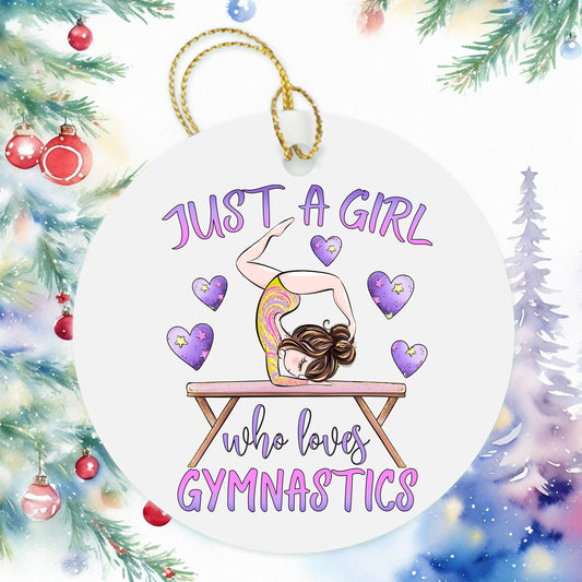 a christmas ornament with a girl doing gymnastics