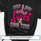 a black shirt with pink lettering that says just a girl who loves shih t