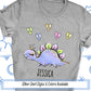 a t - shirt with a dinosaur and hearts on it