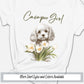 a white shirt with a picture of a dog and flowers