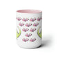a white coffee mug with pink flowers on it