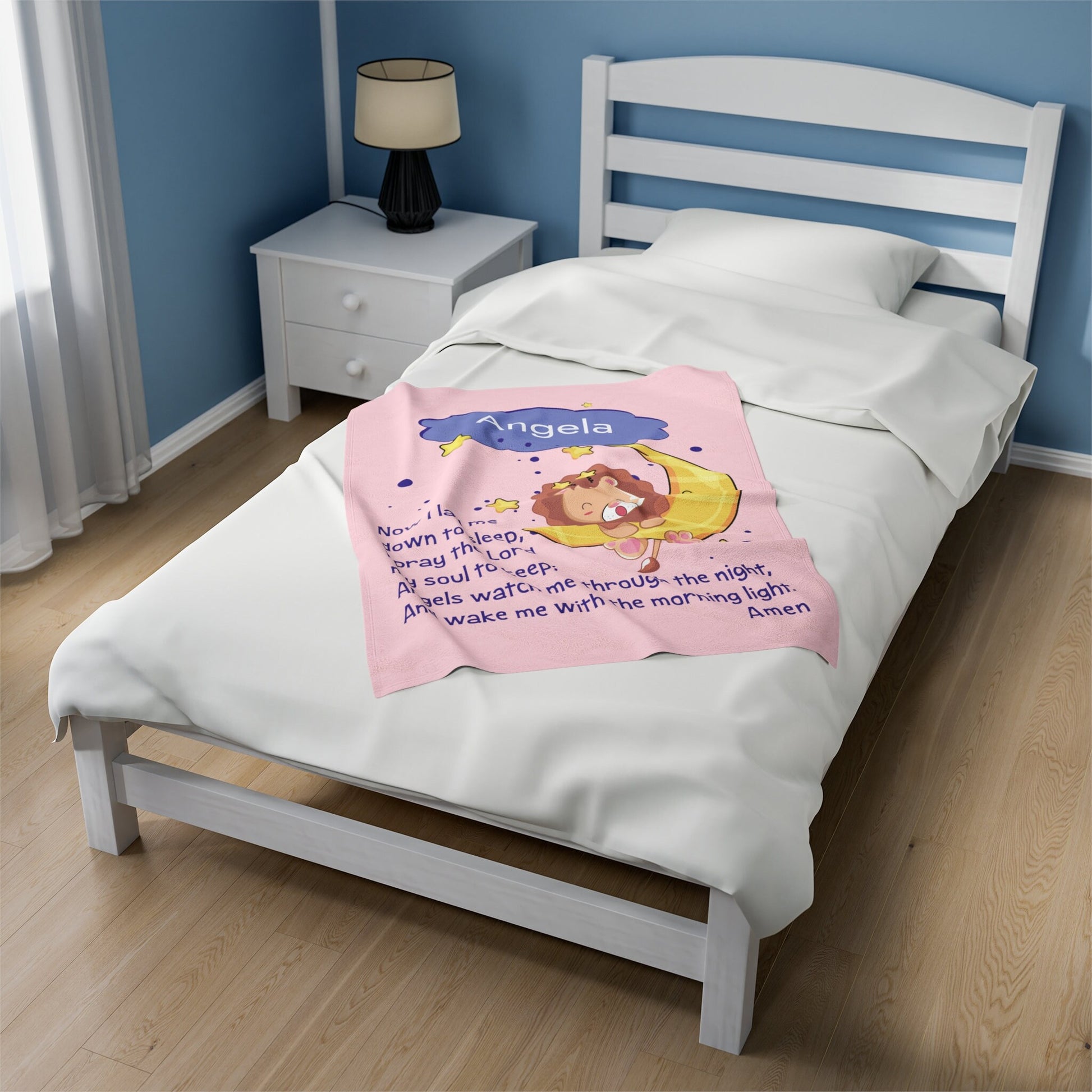 a bed with a pink blanket on top of it