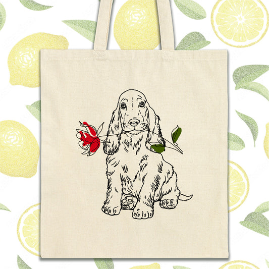 a tote bag with a drawing of a dog holding a rose