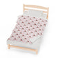 a bed with a red and white bedspread on it