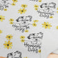 a close up of a napkin with flowers on it