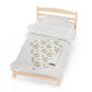 a bed with a white comforter and a wooden headboard