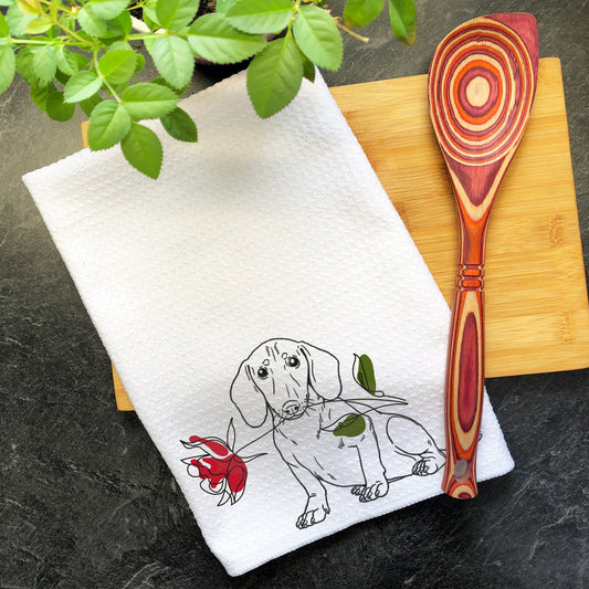 a kitchen towel with a picture of a dog on it