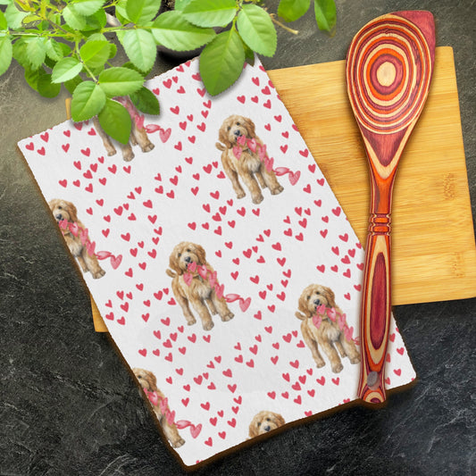 a wooden spoon sitting on top of a cutting board