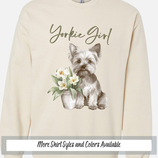 a sweatshirt with a dog and flowers on it