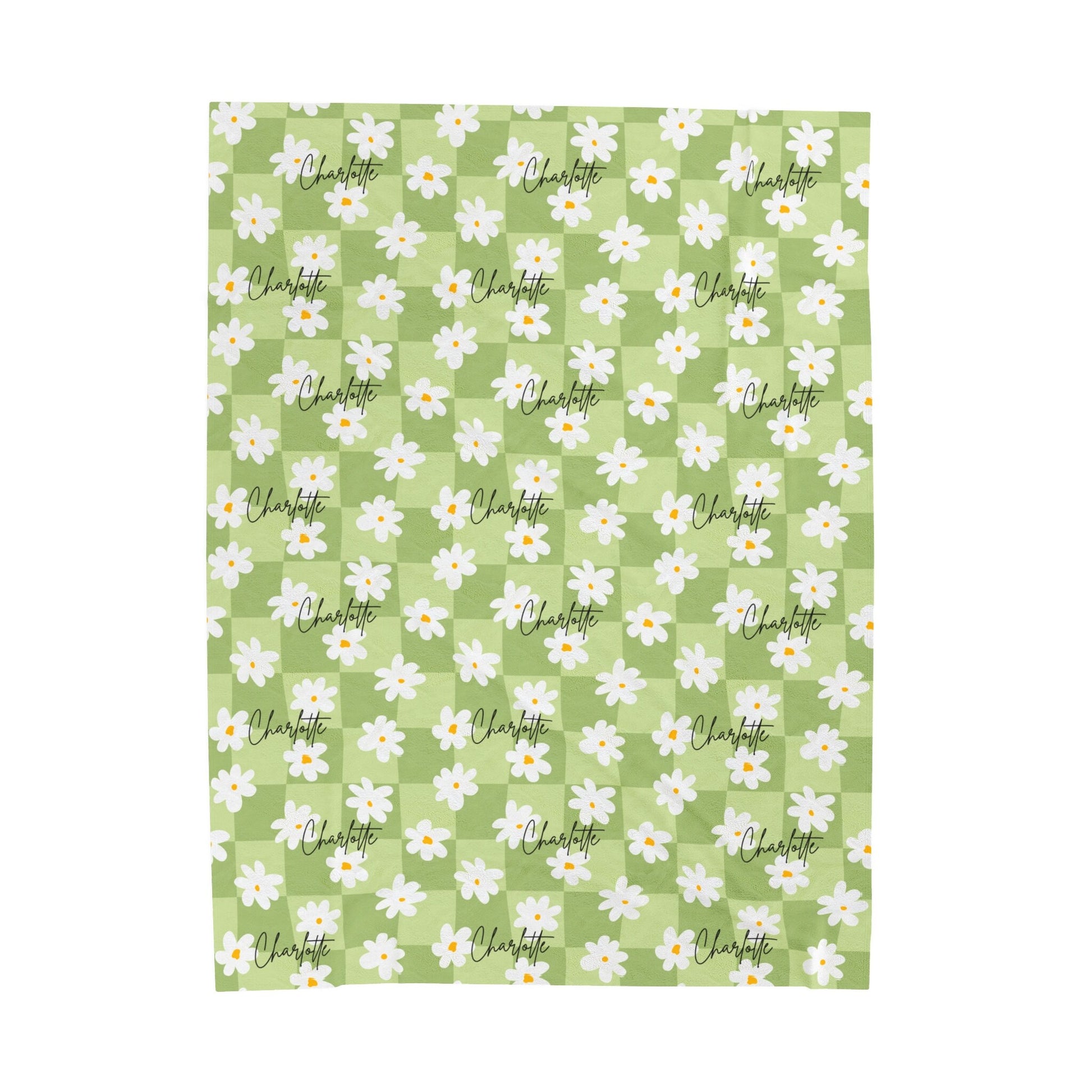 a green and white checkered pattern with daisies