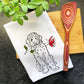 a kitchen towel with a picture of a dog on it