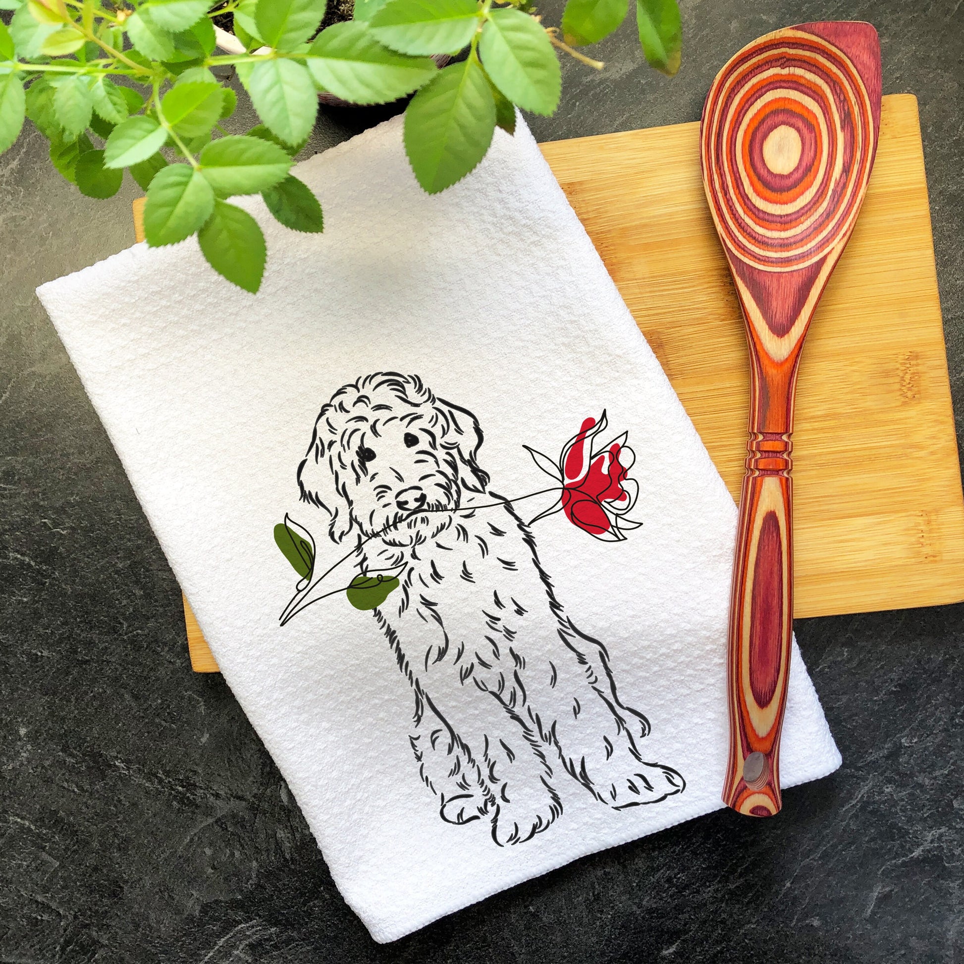 a kitchen towel with a picture of a dog on it