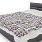 a bed with a white sheet and a black headboard