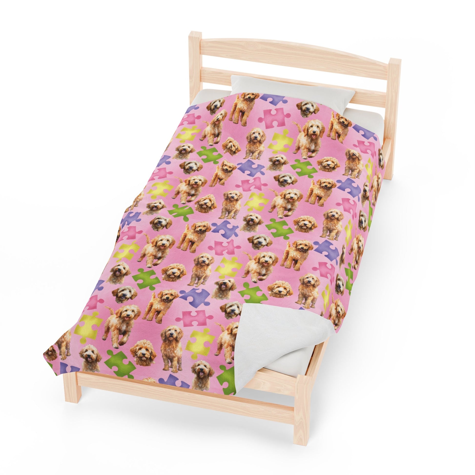 a small bed with a dog pattern on it