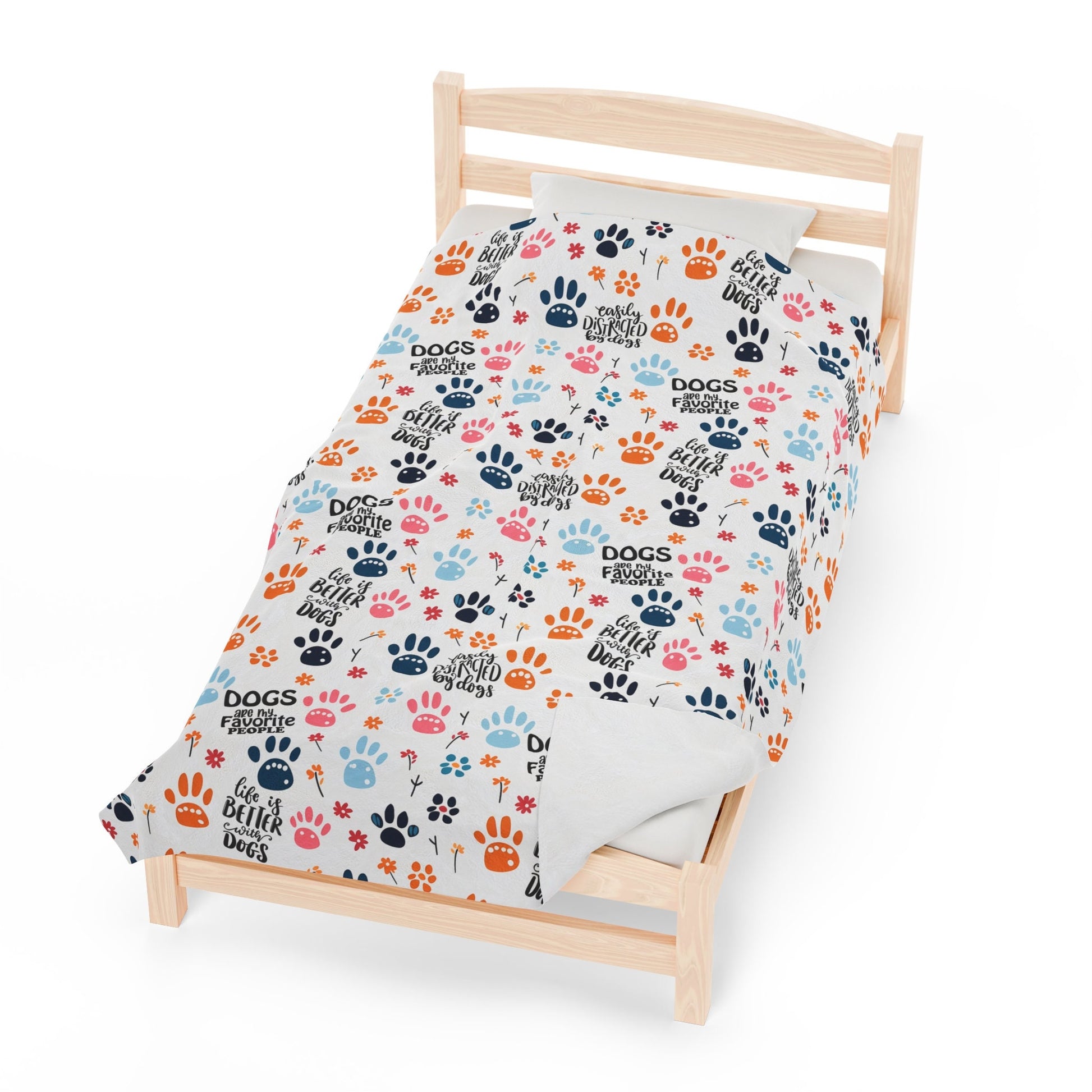 a bed with a dog paw print on it