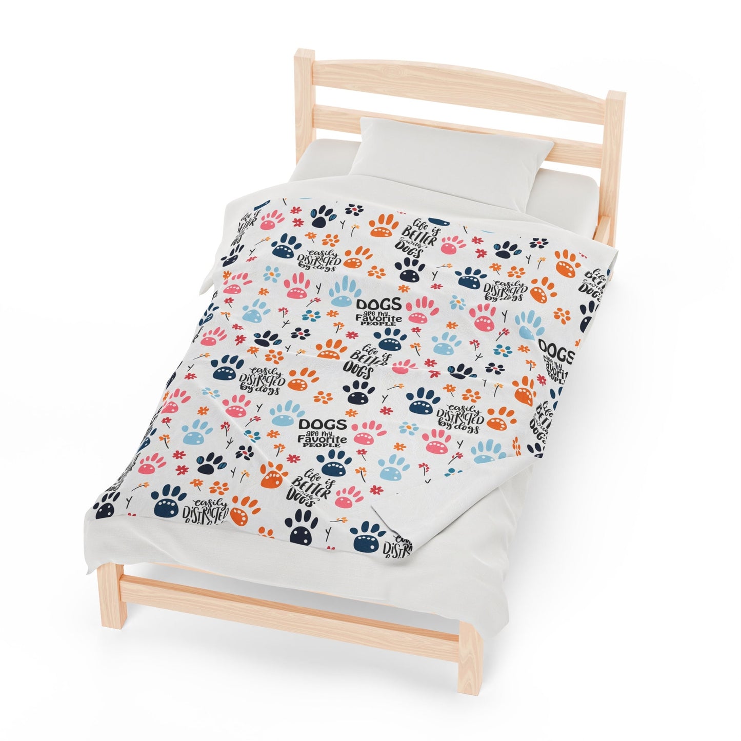 a bed with a dog paw print on it