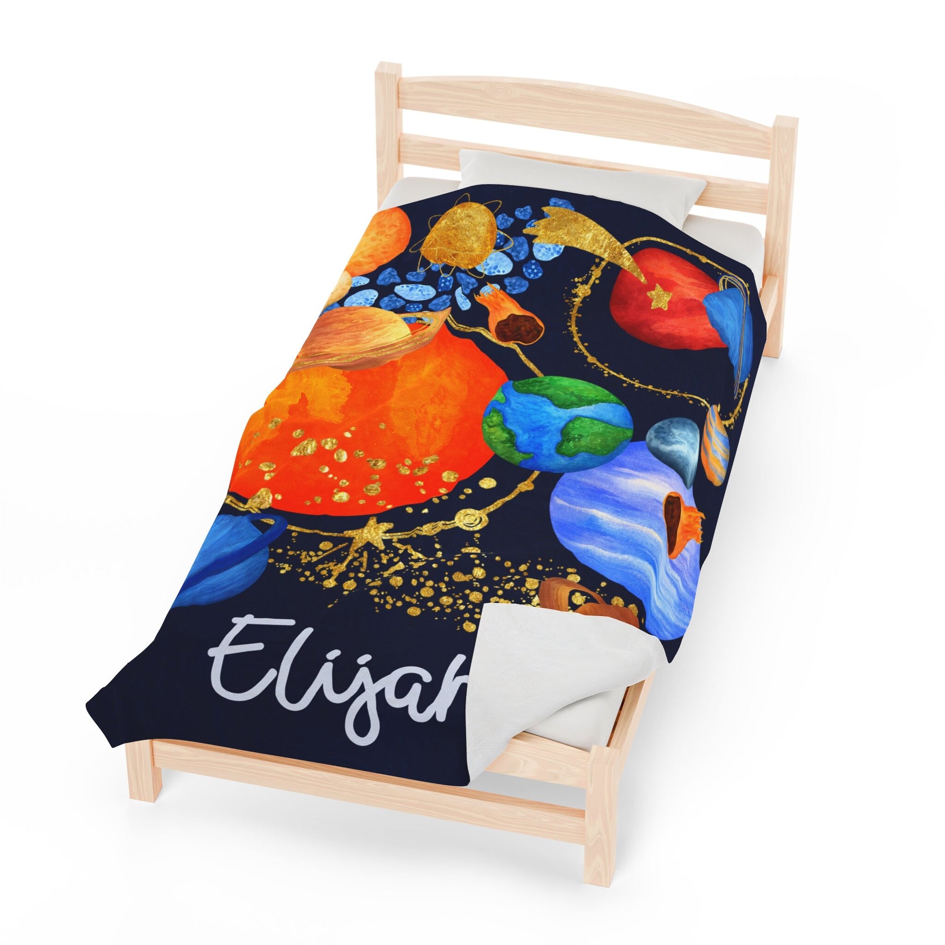 a bed with a blanket on top of it
