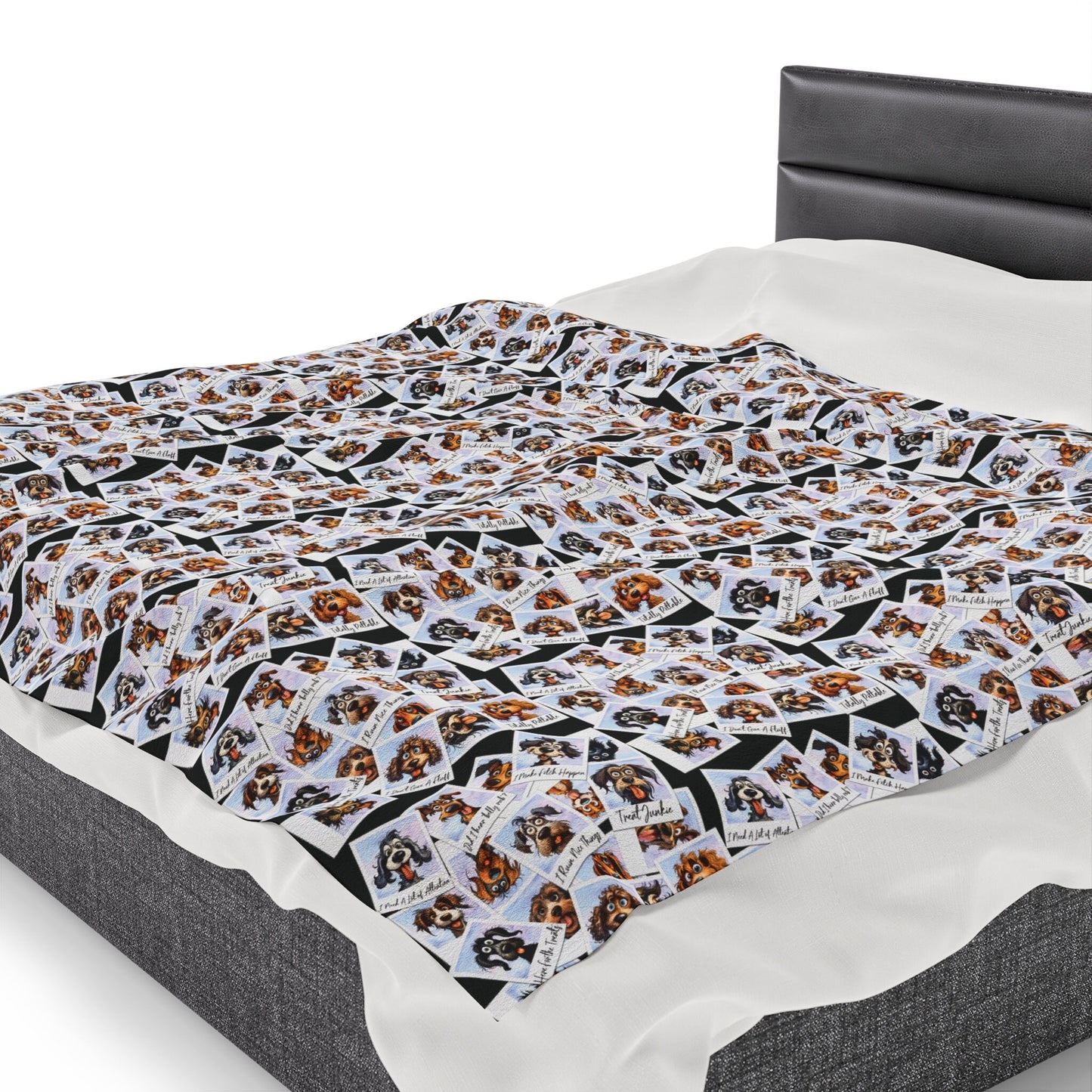 a bed with a black headboard and white sheets