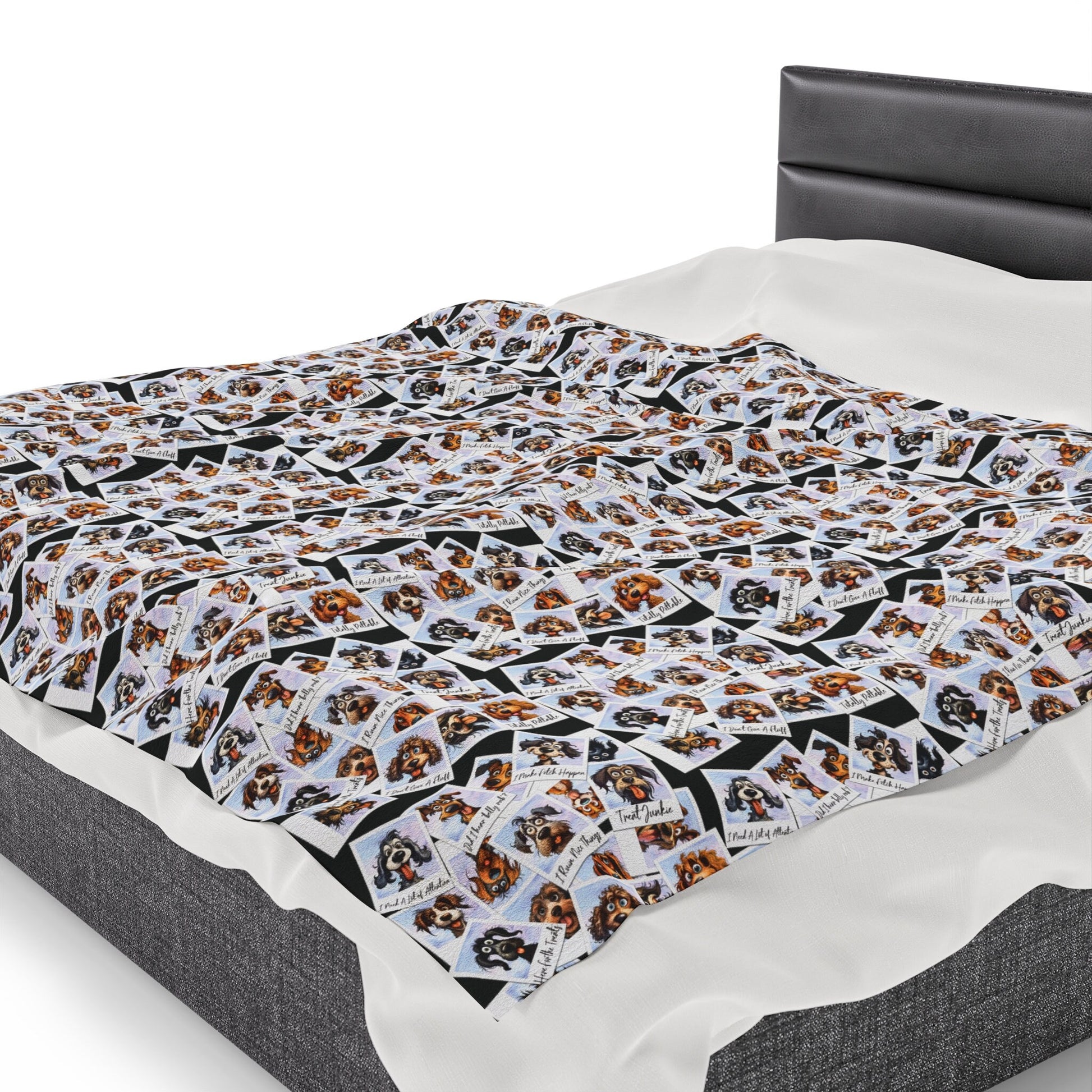 a bed with a black headboard and white sheets