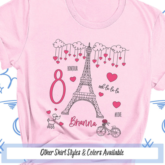 a pink shirt with the eiffel tower on it