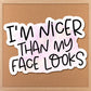 i&#39;m nicer than my face looks sticker on a bulletin board